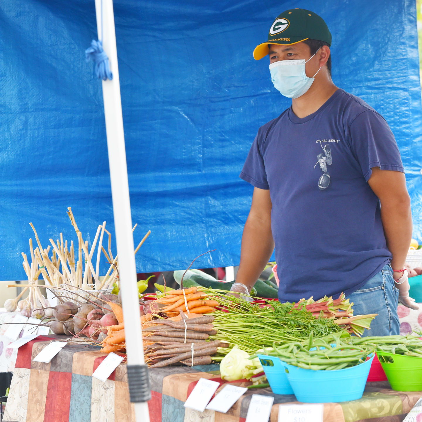 Farmer Teng Yang waits for his next customer